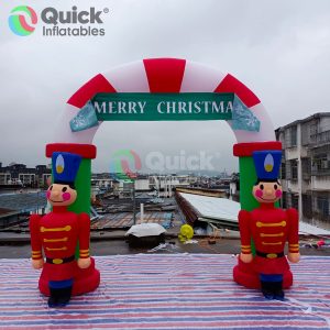 Inflatable Christmas Soldier Guarding the Entrance with Merry Christmas Banner Inflatable Arch for Events